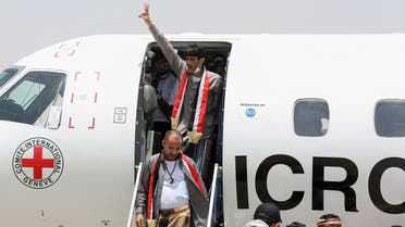 Freed prisoners exit an International Committee of the Red Cross (ICRC)-chartered plane at Marib Airport, amid a prisoner swap between two sides in the Yemen conflict, in Marib, Yemen, on April 16, 2023. Reuters)