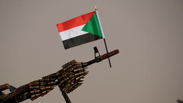 A Sudanese national flag is attached to a machine gun of Paramilitary Rapid Support Forces (RSF) soldiers as they wait for the arrival of Lieutenant General Mohamed Hamdan Dagalo, deputy head of the military council and head of RSF, before a meeting in Aprag village 60, kilometers away from Khartoum, Sudan, June 22, 2019. (Reuters)