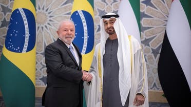 Sheikh Mohamed bin Zayed Al Nahyan, President of the United Arab Emirates (R) and HE Luiz Inacio Lula da Silva, President of Brazil (L), stand for a photograph during an official visit reception, at Qasr Al Watan, Abu Dhabi, UAE, on April 15, 2023. (Reuters)