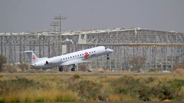 An aircraft of the International Committee of the Red Cross (ICRC) carrying prisoners formerly held by Yemen's Houthis takes off from Sanaa International Airport on April 16, 2023 during a prisoner exchange with the internationally recognised-government. (Photo by Mohammed HUWAIS / AFP)