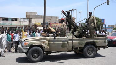 Sudanese greet army soldiers, loyal to army chief Abdel Fattah al-Burhan, in the Red Sea city of Port Sudan on April 16, 2023. (AFP) 