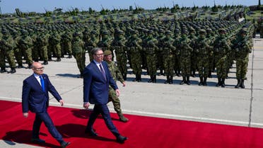 Serbian President Aleksandar Vucic, center, reviews the honor guard during a welcome ceremony before the military exercises at Batajnica military airport near Belgrade, Serbia, Saturday, April 22, 2023. (AP)