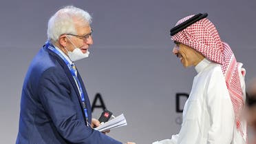 (L to R) EU High Representative for Foreign Affairs and Security Policy Josep Borrell shakes hands with Saudi Arabia’s Foreign Minister Prince Faisal bin Farhan during a plenary session titled “Transforming for a New Era,” during the Doha Forum in Qatar’s capital on March 26, 2022. (AFP)