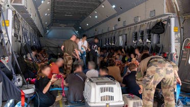 This handout photograph taken on April 23, 2023 and released by the Etat Major des Armees (French defence staff) shows French and other nationalities people as they embark at French military air base in Khartoum to fly to Djibouti on April 23. (File photo: AFP)