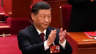 Chinese President Xi Jinping applauds at the closing ceremony for China's National People's Congress (NPC) at the Great Hall of the People in Beijing, March 13, 2023. (AP)