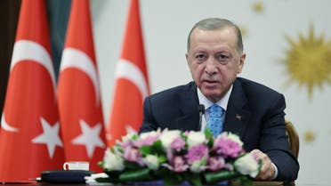 This handout photograph taken on April 27, 2023, shows Turkish President Recep Tayyip Erdogan delivering remarks via live video link at the Presidential Complex in Ankara, Turkey to mark the delivery of nuclear fuel to the country’s first nuclear power plant, Akkuyu, in southern Turkey. (Turkish presidency press office via AFP)