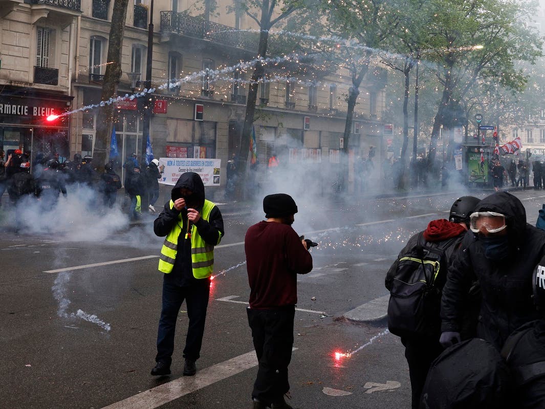 Extinction Rebellion protestor storms Louis Vuitton's Paris