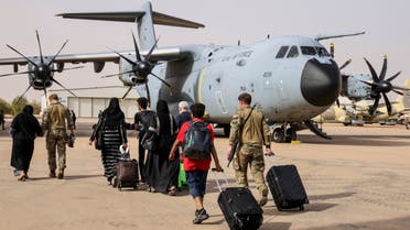 In this handout image provided by the UK Ministry of Defence, on Thursday, April 27, 2023, British Nationals board an RAF aircraft for evacuation of civilians to Larnaca International Airport in Cyprus, at Wadi Seidna military airport, 22 kilometres (14 mi) north of Khartoum, Sudan. (AP)