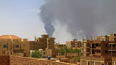 Smoke billows over residential buildings in Khartoum on May 1, 2023 as deadly clashes between rival generals' forces have entered their third week. The top United Nations humanitarian official is heading to the Sudan region due to the rapidly deteriorating humanitarian crisis in the conflict-racked country, the UN chief said. (Photo by AFP)