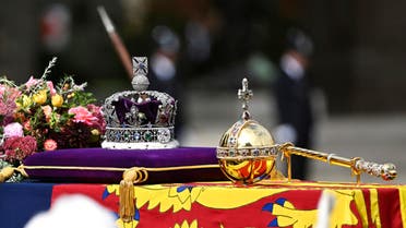 The coffin, draped in the royal standard with the imperial state crown and the sovereign's orb and scepter, is seen during the state funeral of late Queen Elizabeth II in London, Monday, Sept. 19, 2022. (AP)