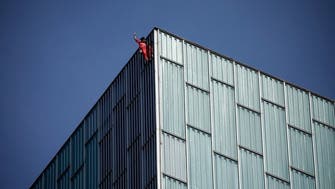 ‘French Spiderman’ crawls up Barcelona skyscraper in climate action