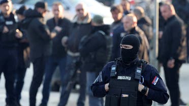 Security personnel operate, in the aftermath of a shooting, in Dubona, Serbia, on May 5, 2023. (Reuters)