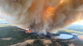 Wildfires and floods across western Canada force evacuations