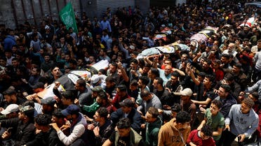Mourners attend the funeral of senior Palestinian Islamic Jihad commanders Tareq Izzeldeen and Khalil Al-Bahtini, and other Palestinians who were killed in Israeli strikes, in Gaza City, May 9, 2023. (Reuters)