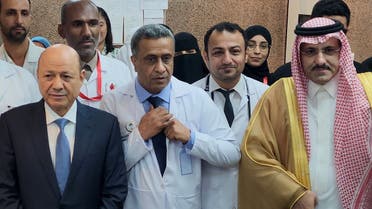 Saudi Arabia’s ambassador to Yemen Mohammed al-Jaber (R) and Rashad al-Alimi (L), President of Yemen’s new leadership council, pose for a picture during the unveiling of a renovated hospital in Aden on May 10, 2023. (AFP)
