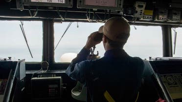 Ensign Gordon Kitchener looks out from the bridge of the guided-missile destroyer USS Paul Hamilton (DDG 60), May 9, 2023 in the Arabian Gulf. (US Navy)