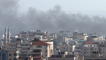 Smoke rises following an Israeli strike, in Gaza, on May 13, 2023. (Reuters) 
