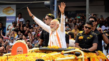 Indian Prime Minister Narendra Modi waves to the crowd during a road show to campaign for his Bharatiya Janata Party (BJP) ahead of the elections in Bengaluru, India, Sunday, May 7, 2023. (AP)