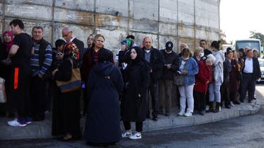 Voters stand in a queue outside a polling station in Istanbul, Turkey May 14, 2023. REUTERS/Hannah McKay