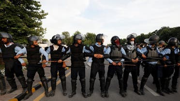Police officers stand in a position to stop the supporters of Pakistan's former Prime Minister, Imran Khan, as he appeared before the Supreme Court in Islamabad, Pakistan May 11, 2023. REUTERS