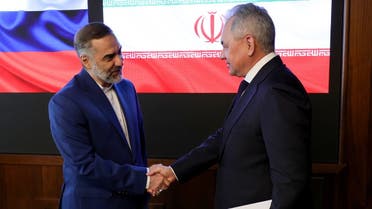 Russian Defense Minister Sergei Shoigu (R) meets with his Iranian counterpart Mohamed Reza Qarai Ashtiani in Moscow on April 25, 2023. (AFP)