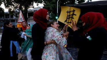 Police officers detain female supporters of Pakistan’s former Prime Minister Imran Khan, as they gather for what they call ‘a true freedom protest,’ demanding ‘Save Constitution - Save Pakistan,’ in Islamabad, Pakistan, on May 14, 2023. (Reuters)