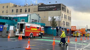 Firefighters work near a hostel in central Wellington, New Zealand, Tuesday, May 16, 2023. Several people were killed after a fire broke out overnight at the four-story building. (Ben McKay/AAP Image via AP)