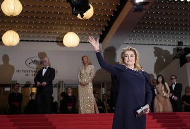 Catherine Deneuve poses for photographers upon arrival at the opening ceremony and the premiere of the film 'Jeanne du Barry' at the 76th international film festival, Cannes, southern France, Tuesday, May 16, 2023. (AP)