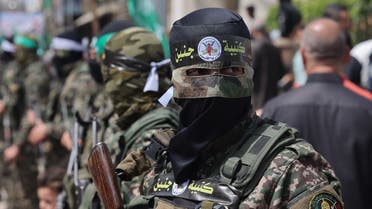 Masked members of Hamas stand position during a rally in solidarity with Jerusalem’s Al-Aqsa Mosque, in Jabalia, in the northern Gaza Strip on April 7, 2023. (AFP)