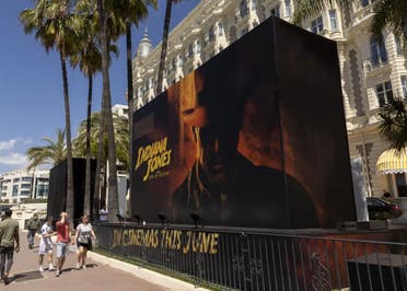 The official poster for 'Indiana Jones and the Dial of Destiny' is pictured outside the entrance of the Carlton hotel ahead of the Cannes film festival, in Cannes, southern France, Monday, May 15, 2023. The 76th edition of the film festival runs from May 16 until May 27. (AP)