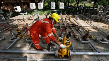 A technician works inside the Oil and Natural Gas Corp (ONGC) group gathering station on the outskirts of Ahmedabad, India. (Reuters)