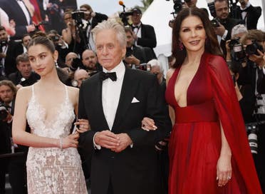 Carys Zeta Douglas, from left, Michael Douglas and Catherine Zeta-Jones pose for photographers upon arrival at the opening ceremony and the premiere of the film 'Jeanne du Barry' at the 76th international film festival, Cannes, southern France, Tuesday, May 16, 2023. (AP)
