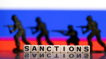 FILE PHOTO: Plastic letters arranged to read Sanctions and solider toys are placed in front of Russia's flag colors in this illustration taken February 25, 2022. (Reuters)
