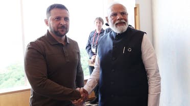 Ukrainian President Volodymyr Zelenskyy shakes hands with Indian Prime Minister Narendra Modi in Hiroshima. (Twitter)