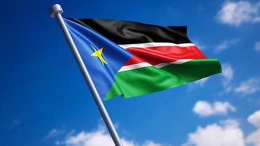 Flag of South Sudan against blue sky stock photo