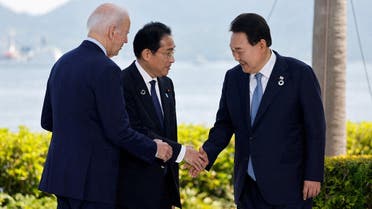 US President Joe Biden, Japan’s Prime Minister Fumio Kishida and South Korea’s President Yoon Suk Yeol attend a photo op on the day of trilateral engagement with during the G7 Summit at the Grand Prince Hotel in Hiroshima, Japan, on May 21, 2023. (Reuters)