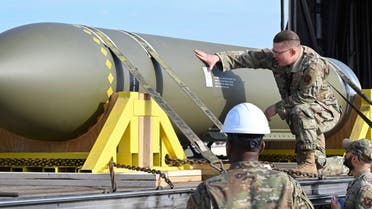 In this photo released by the US Air Force on May 2, 2023, airmen look at a GBU-57, or the Massive Ordnance Penetrator bomb, at Whiteman Air Base in Missouri. (AP)