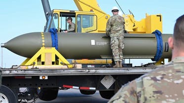 In this photo released by the US Air Force on May 2, 2023, airmen look at a GBU-57, or the Massive Ordnance Penetrator bomb, at Whiteman Air Base in Missouri. (AP)
