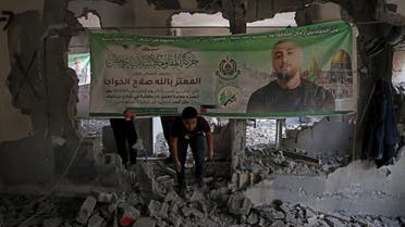 People inspect the house of Palestinian militant Mutaz Khawaja who carried out a deadly shooting attack in Tel Aviv, after it was razed by Israeli security forces in the West Bank village of Nilin on May 23, 2023. (AFP)
