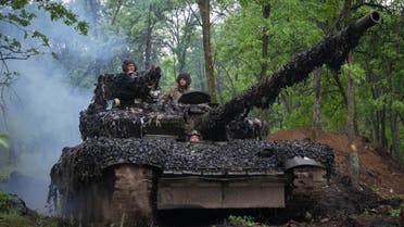 Ukrainian soldiers on a tank ride along the road towards their positions near Bakhmut, Donetsk region, Ukraine, Tuesday, May 23, 2023.(AP Photo/Efrem Lukatsky)