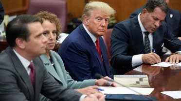Donald Trump sits at the defense table with his legal team in a Manhattan court, 4 April 2023, in New York. Photograph: Seth Wenig/AP