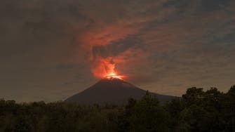 Mexico keeps close watch on ash-spewing volcano, maintains warning level