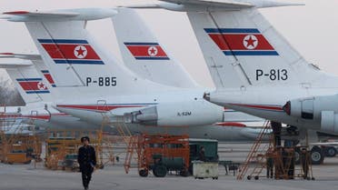 North Koreans work at the Sunan airport in Pyongyang November 12, 2008. (REUTERS)