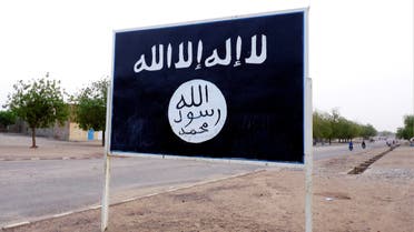 The black flag of the Ansar Dine Islamic group is posted on a road sign in Kidal in northeastern Mali, June 16, 2012. (Reuters)