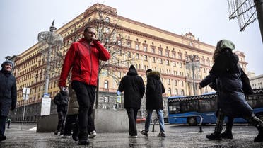 People walk past the headquarters of the Federal Security Service (FSB), the successor agency to the KGB, and Lubyanka Square in front of it in central Moscow on March 3, 2023. (AFP)