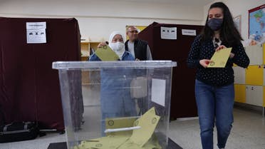 Voters cast their ballots at a polling station during the presidential runoff vote in Ankara on May 28, 2023. (AFP)