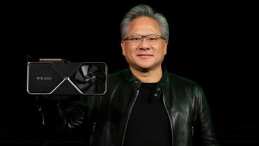 Nvidia Corp CEO Jensen Huang holds one of the company's new RTX 4090 chips for computer gaming in this undated handout photo provided on September 20, 2022. (Reuters)