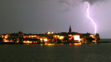 Lightning is seen over the Isola Superiore dei Pescatori at Lago Maggiore lake near the town of Baveno some 70 kilometres north of Milan. (File photo: Reuters)
