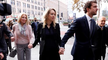 FILE PHOTO: Theranos founder Elizabeth Holmes arrives with her family and partner Billy Evans to be sentenced on her convictions for defrauding investors in the blood testing startup at the federal courthouse in San Jose, California, U.S., November 18, 2022. REUTERS/Brittany Hosea-Small/File Photo
