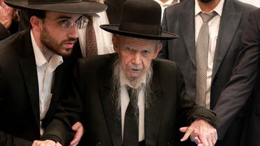 Israel’s Rabbi Yerachmiel Gershon Edelstein is helped to cast his ballot at a polling station in Bnei Brak, an Orthodox Jewish city near Tel Aviv, on November 1, 2022. (AFP)